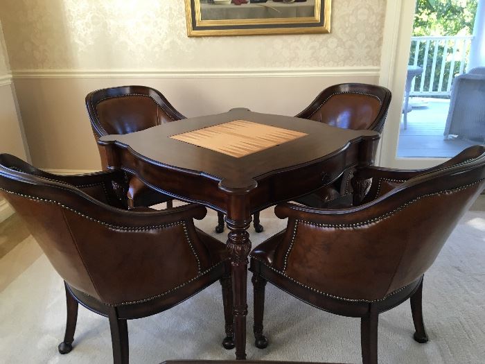 Fabulous game table with 4 leather chairs.