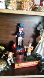 UNCLE SAM & TRICK DOG --- Animated Penny Banks --- of Die Cast Metal.  Show your Child how to Save, and let them have some fun doing it.