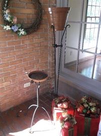 Plant stands and lighted Christmas package decorations