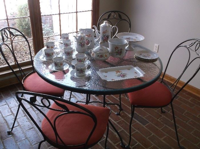 Round glass top table and four chairs