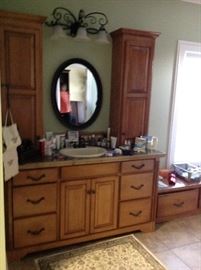 Master bathroom vanity, cabinets, mirro and overhead lighting fixture. Alll for sale in this beautiful on suite.