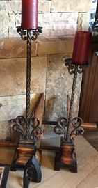 large metal candle stands and old sad iron