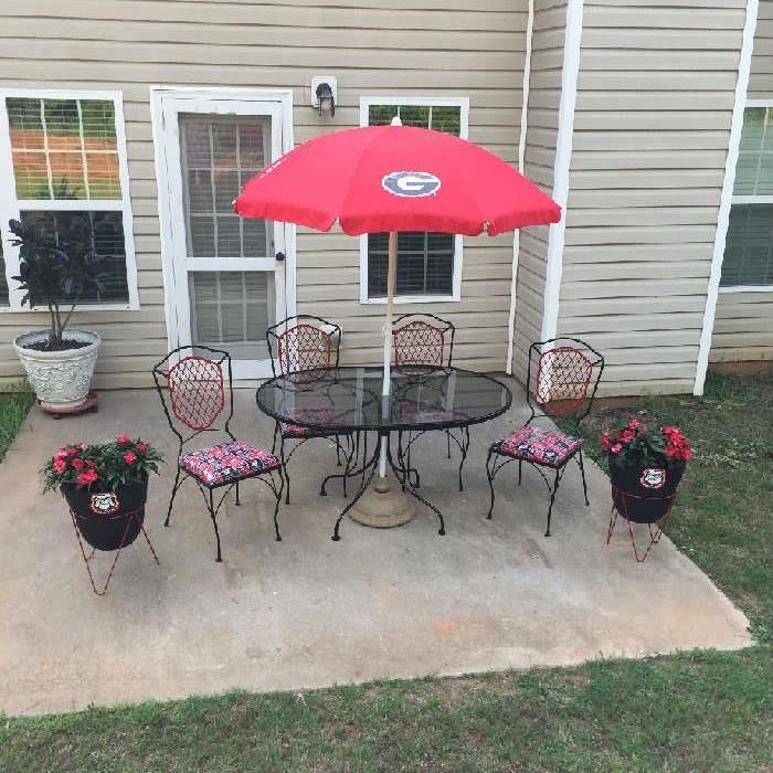 UGA Set. Stored indoors. Everything in like new. Umbrella never used. Has new iron umbrella stand now. $300.00