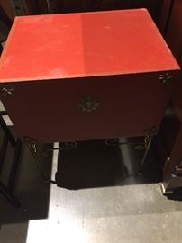 Red faux leather warp box on iron base
