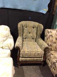 Upholstery and wooden tufted armchair