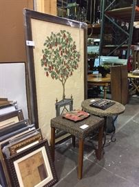 Large painting behind a couple great tables