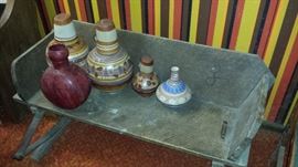 Buck board w/ much southwest pottery