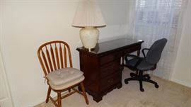 Mahogany Kneehole Desk. Gray Office Chair. Oak Arrow-Back Chair