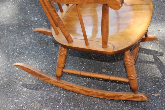 Vintage Rocking Chair

Well kept by an antiques collector. 40"t x 24 1/2"w x approx 28"d. Bottom reads Nichols & Stone Co. The Home of Windsor Chairs Gardner Massachusetts 73 - 6 #20 antique -Spindled Legs, well kept in the same family for over 50 years!