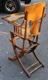 Oak High Chair/Rocker

Beautifully carved antique high chair, very great condition. Can be repositioned into a baby rocker, see photos. Caned seat, inset food tray.

Measures 40 3/4"T x 17 1/2"W x 19"D in standing position.

Measures 27"T x 17 1/2"W x 28" in rocker position. 