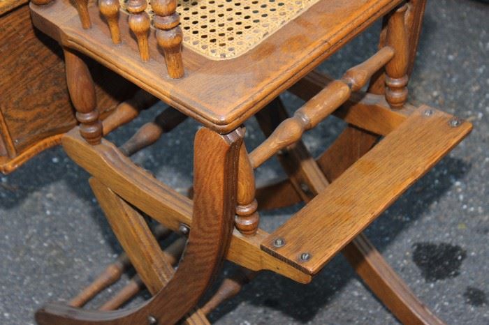 Oak High Chair/Rocker

Beautifully carved antique high chair, very great condition. Can be repositioned into a baby rocker, see photos. Caned seat, inset food tray.

Measures 40 3/4"T x 17 1/2"W x 19"D in standing position.

Measures 27"T x 17 1/2"W x 28" in rocker position. 