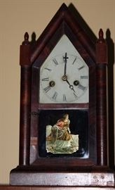 Antique Ansonia Steeple Clock & Antique Wall Shelf

Ansonia Brass and Copper Co. Ansonia, Conn. Pretty and nicely kept in a non-smoking home. Comes with Wood Wall Hanging Shelf shown in photos! Clock measures 16"t x 8 1/2"w x 4"d.

Shelf is 8"t x 24"w x 7"d and appears to be quite old, handmade.