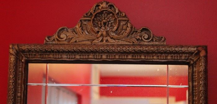 Very elegant and well-kept Federal Style Antique Mirror

Some visible wear as shown in photos, but a beautiful piece nonetheless.

Measures 32 1/2"T x 16 1/2"W x 1 1/2"D

Mirror has decorative inlaid beveling, frame is ornately etched with a scrolled crown.