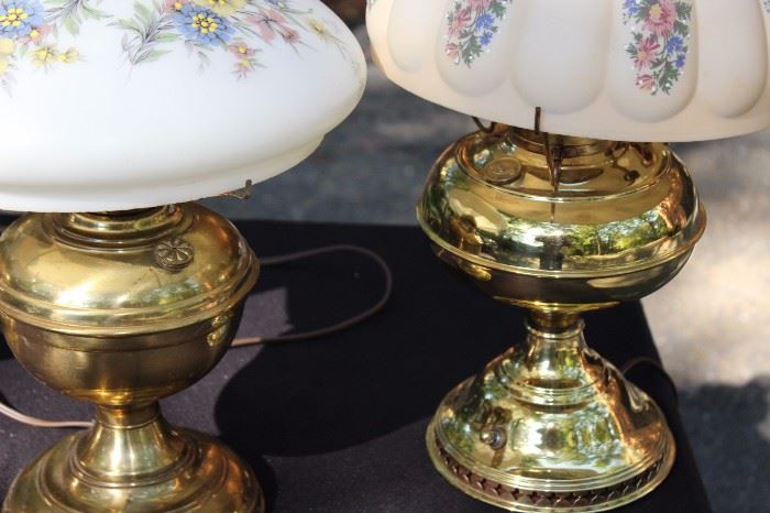 Trio of Vintage Brass Lamps with Floral Glass Shades

All three are tested and working. Very good condition, minimal wear of the brass. Thick white glass shades with floral illustrations. Two have inner decorative hurricane shades encompassing the lightbulb within the painted shades.

Fully assembled, they measure:
17 1/2"T, 21 1/2"T and 18 1/2"T