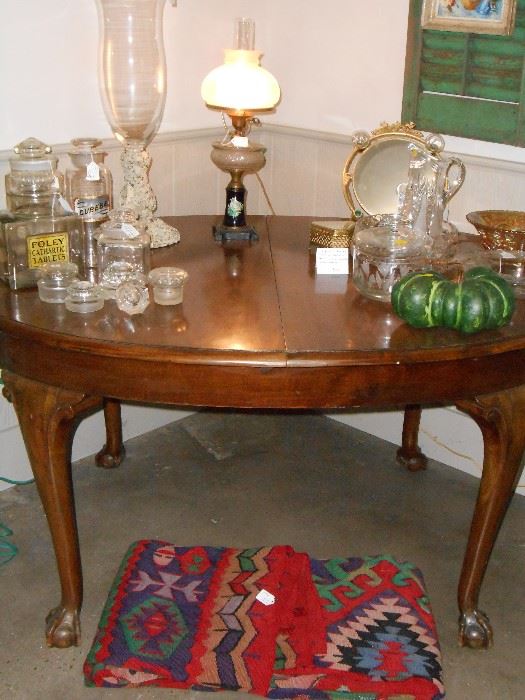 dining table, lamp, apothecaries, antique kilim