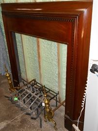 mahogany mantel, iron grates, and brass andirons