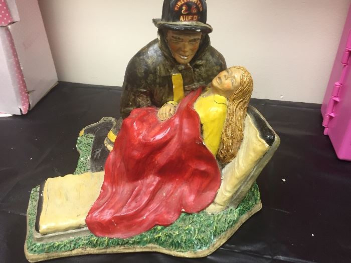 Fireman saving lady statue $10
