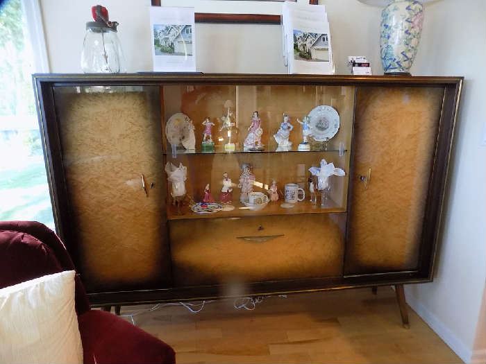 This is a mid century  beautiful cabinet from Germany. 1950's.  Beautiful condition. $Burled maple, key in each section. Sliding glass doors. Asking $750 or best offer.