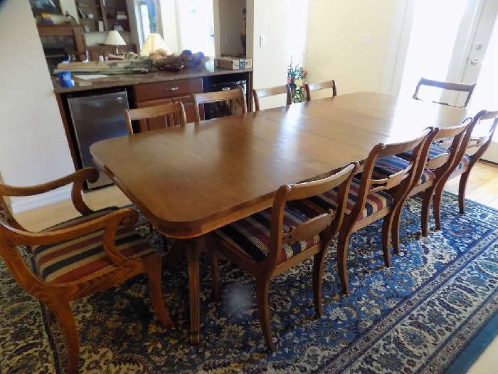 Mahogany dining  table with extra leaves. Very large. 11 chairs. $450