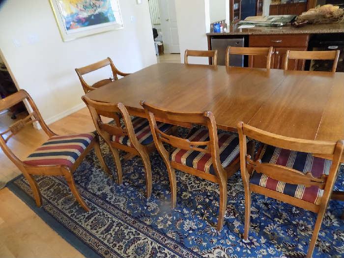 Table is 98 in. in length with 3 leaves. without is 62 in. long. 42 in. wide. 3 extra leaves 12 in. each .11 chairs. 1950's.  $450