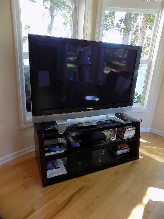 flat screen T.V with beautiful stand. 