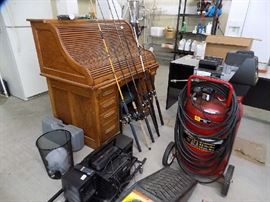 Antique roll-top  desk, $350, fishing poles 