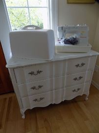 Singer sewing machine.$50  White chest with matching mirror.