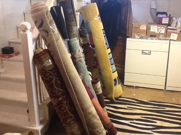 Various floral and zebra striped rugs. Sizes small to large