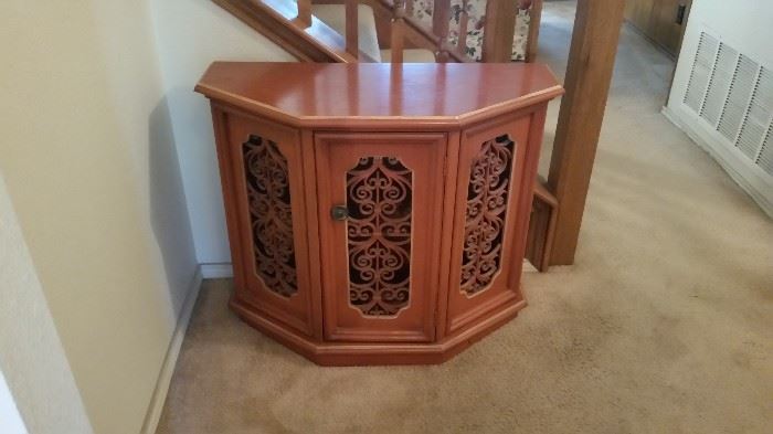 Pretty small buffet/ side storage with cut out filigree details  $185.00  Stowers Furniture 