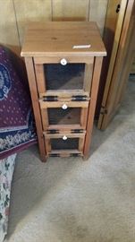 small oak storage unit $30.  3 cabinets with mesh fronts and drop down doors