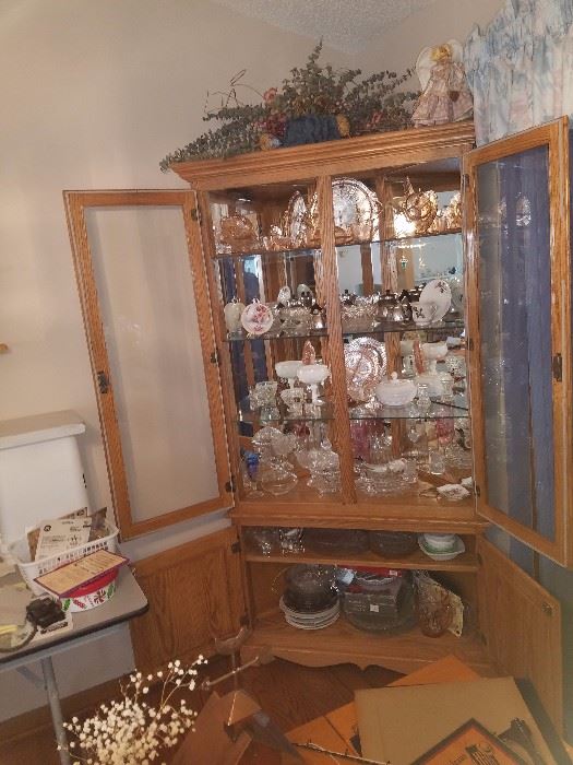 Oak China Cabinet built in work shop. Beautiful piece filled with
Crystal and pink depression glass.