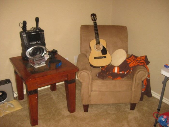 child's guitar, kareoke machine, upholstered chair and table