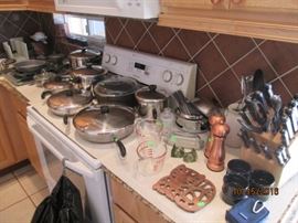 Pots and pans and very nice kitchen items, knife set, copper accessories