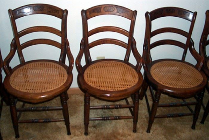Three of six matching cane bottom chairs