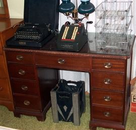 Desk, old typewriter, old adding machine, wire file baskets, etc...