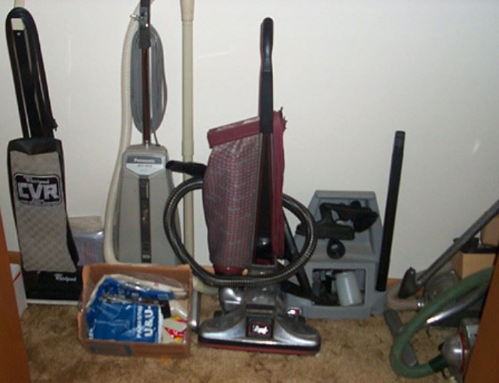 Assortment of vacuum cleaners including Kirby, Electrolux, Air-Way (Toledo, Ohio), Panasonic, etc...
