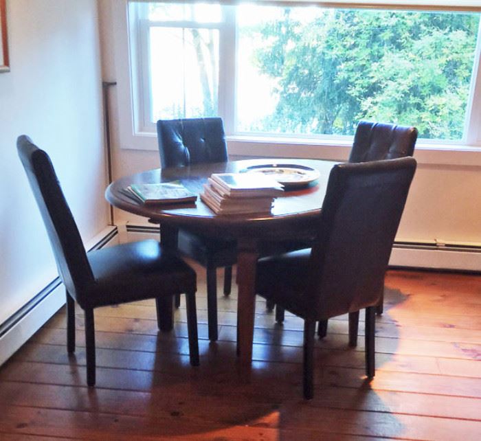 Vintage/semi-antique wood table with new leather Parson's chairs. 