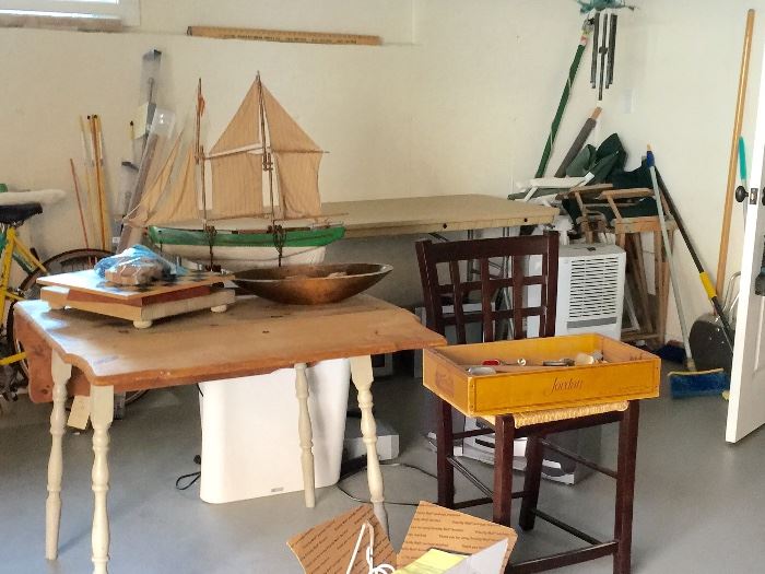 Some of the things we unearthed today -- pond boat, wooden items, vintage table, a dehumidifier in the back, wind chimes, bikes, lots, lots more...