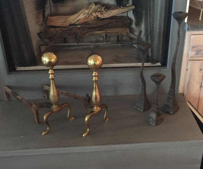 Old brass andirons, great shape and contemporary set of cast iron candlesticks.  Fireplace grate is for sale, too.
