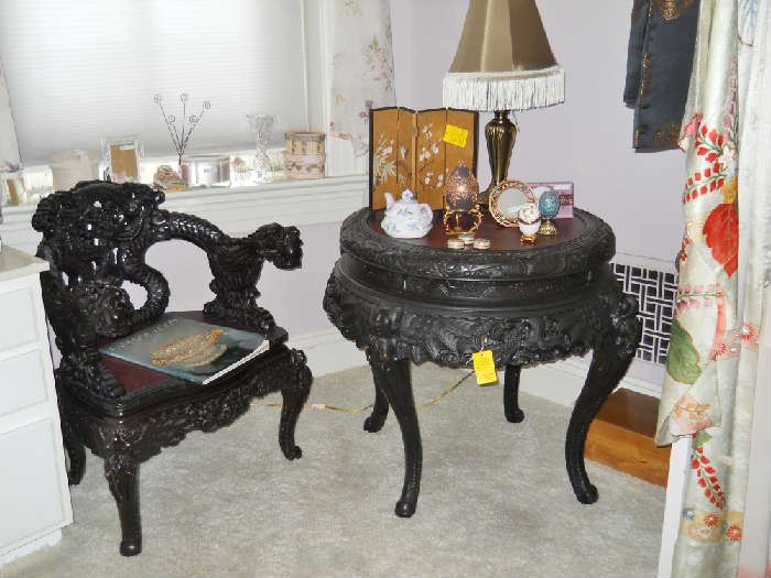 heavily carved chair and table