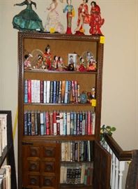 bookcase, dolls, books, etc.