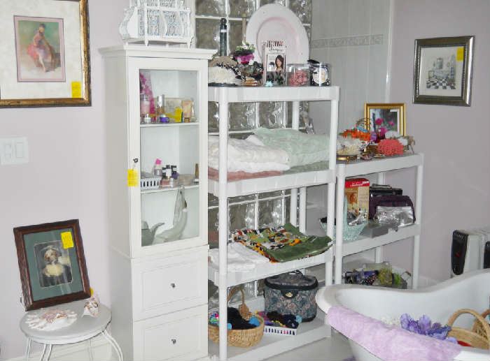 adorable cabinet, health and beauty items, linens, etc.