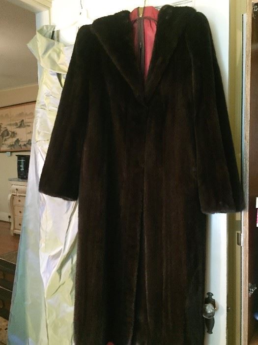 Stunning full length black mink coat.  Fur is soft and supple..under fur is extremely plush.  Guard hairs are long and glistening.  Black satin lining in pristine condition, 2 deep velvet lined pockets.