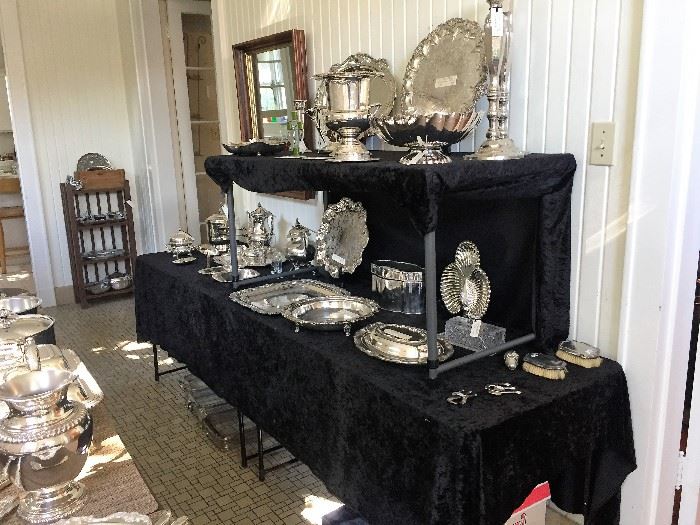 Many, many, many silver plated serving pieces, trays, candlesticks, etc.