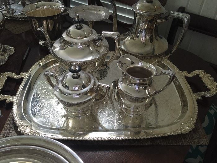 One of several silver plated tea sets with tray