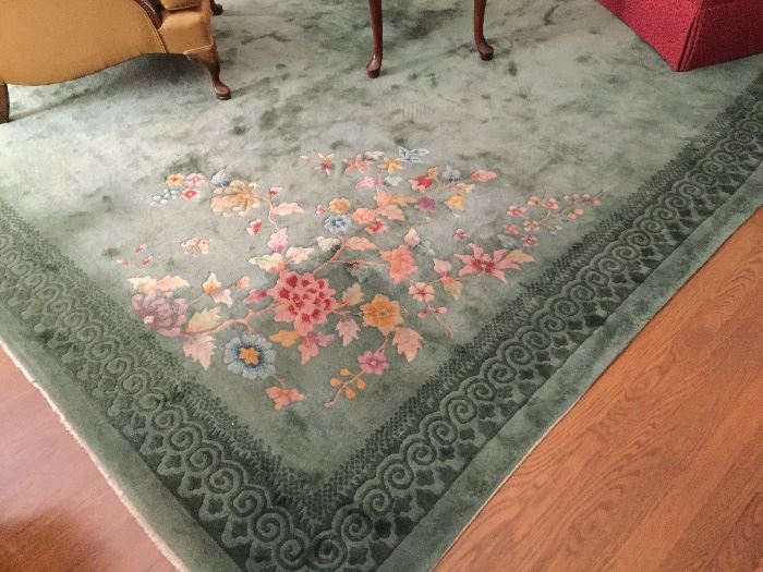 Chinese wool rug. Both scattering's of flowers are unique.