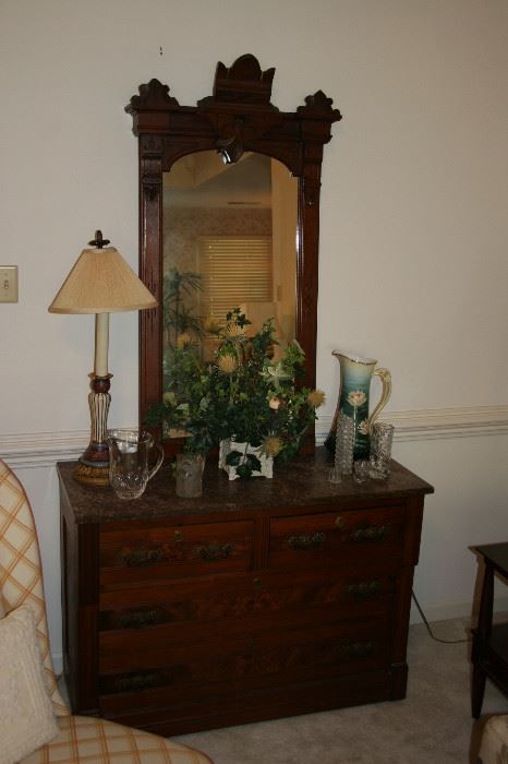 Eastlake mirror & dresser with marble top, Bavarian pitcher, silk plant, glass pitchers