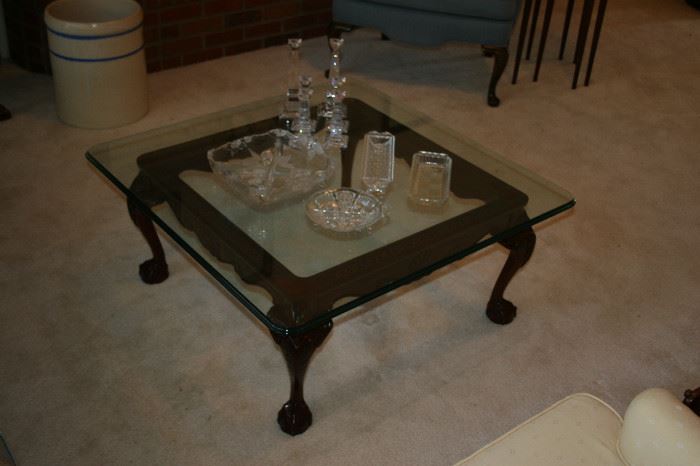 Carved Mahogany coffee table with glass top