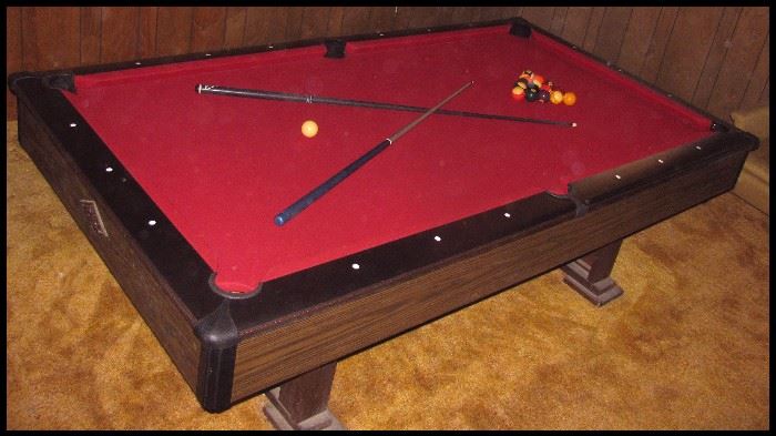 Slate top pool table in excellent condition also several cues and balls