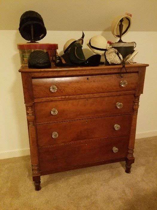 lovely antique dresser chest with vintage hats displayed on top.  Upstairs